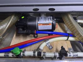 Photo by Rod. The pump runs fine, but I was surprised that the pressure screw had to come to so far out to make it run correctly. Oct 2025 - Flojet Quiet Quad Automatic Water Pump - 12V / 12.5L/min / 35psi