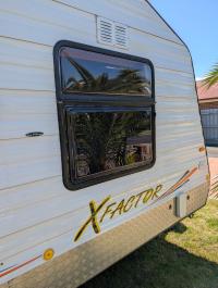 Photo by Warren From VIC. Replaced bottom half of the original Camec double frame window with the Traveler window. Oct 2025 - Aussie Traveller Single-Hopper Wind-Out Window - Black Frame - 565mm H x 914mm W