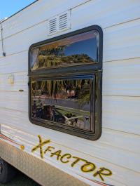 Photo by Warren From VIC. Replaced bottom half of the original Camec double frame window with the Traveler window. Oct 2025 - Aussie Traveller Single-Hopper Wind-Out Window - Black Frame - 565mm H x 914mm W