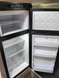 Photo by Manfred. I finished off the install with black 20mm by 20mm aluminium angle fixed using double sided tape.. Jan 2026 - Sphere Upright Compressor Fridge / Freezer - 175L - 12V