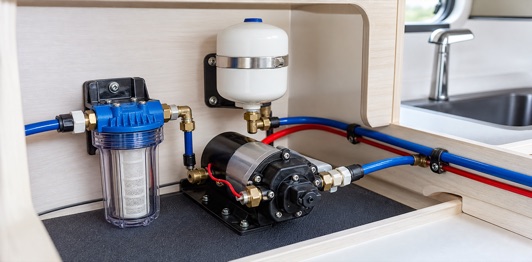 Caravan water pump setup with filter, accumulator and tidy plumbing
